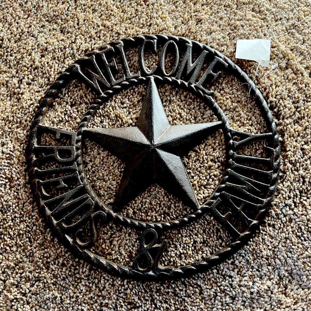 Cast iron welcome sign. “WELCOME FRIENDS & FAMILY”